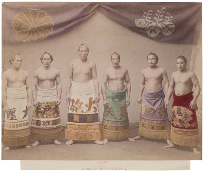 Lot 72 - Japan. A group of wrestlers, c. 1890s, hand-tinted albumen print