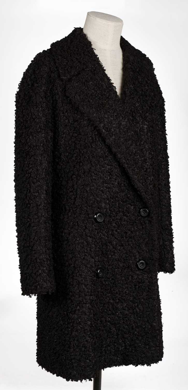 Lot 458 - Clark (Ossie, 1942-1996). A black bouclé coat, & another similar