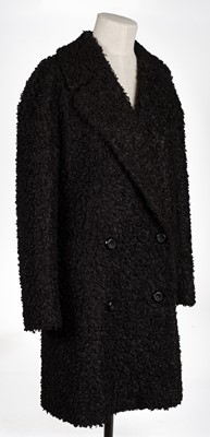 Lot 458 - Clark (Ossie, 1942-1996). A black bouclé coat, & another similar