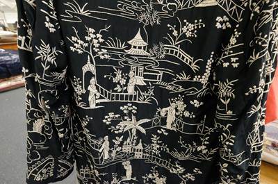 Lot 456 - Chinese. An embroidered coat, early 20th century, & an embroidered jacket and skirt