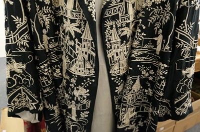 Lot 456 - Chinese. An embroidered coat, early 20th century, & an embroidered jacket and skirt