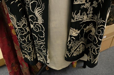 Lot 456 - Chinese. An embroidered coat, early 20th century, & an embroidered jacket and skirt