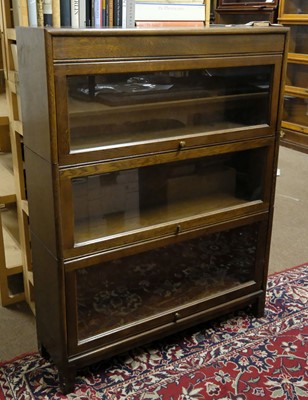 Lot 387 - Bookcases. A pair of 1930s mahogany 3-tier library bookcases