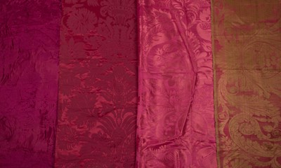 Lot 483 - Fabric. A group of red damask fabric pieces, 18th and 19th century