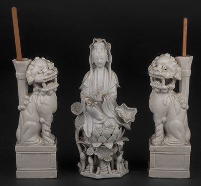 Lot 575 - Chinese figures. A pair of Chinese blanc de chine porcelain figures of Buddhist lions