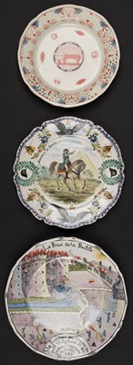 Lot 604 - Plates. A French faience plate and two others