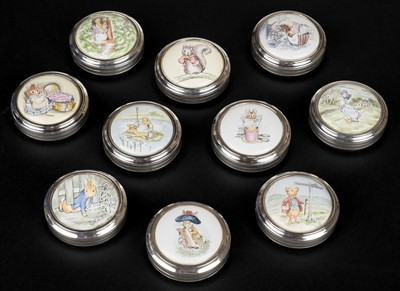 Lot 481 - Potter (Beatrix). A set of 10 silver and enamel trinket boxes by James House Company