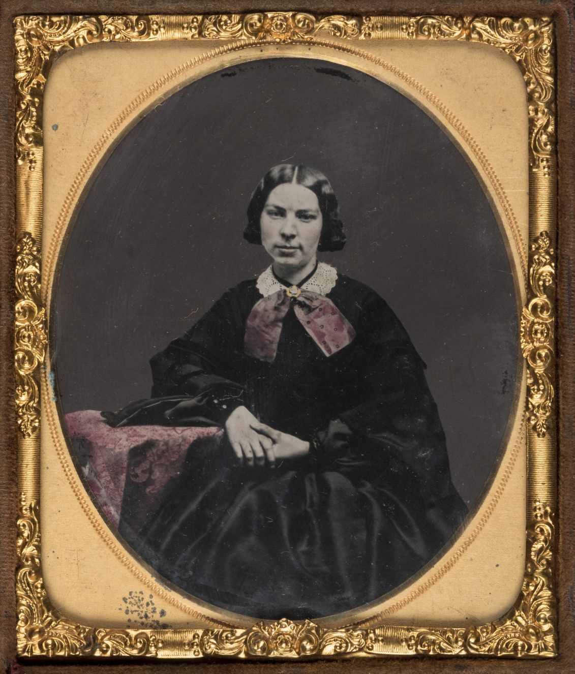 Lot 334 - Sixth-plate tinted ambrotype of a woman